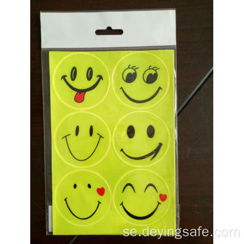 Reflekterande klistermärke för stort leende ansikte för skolväska